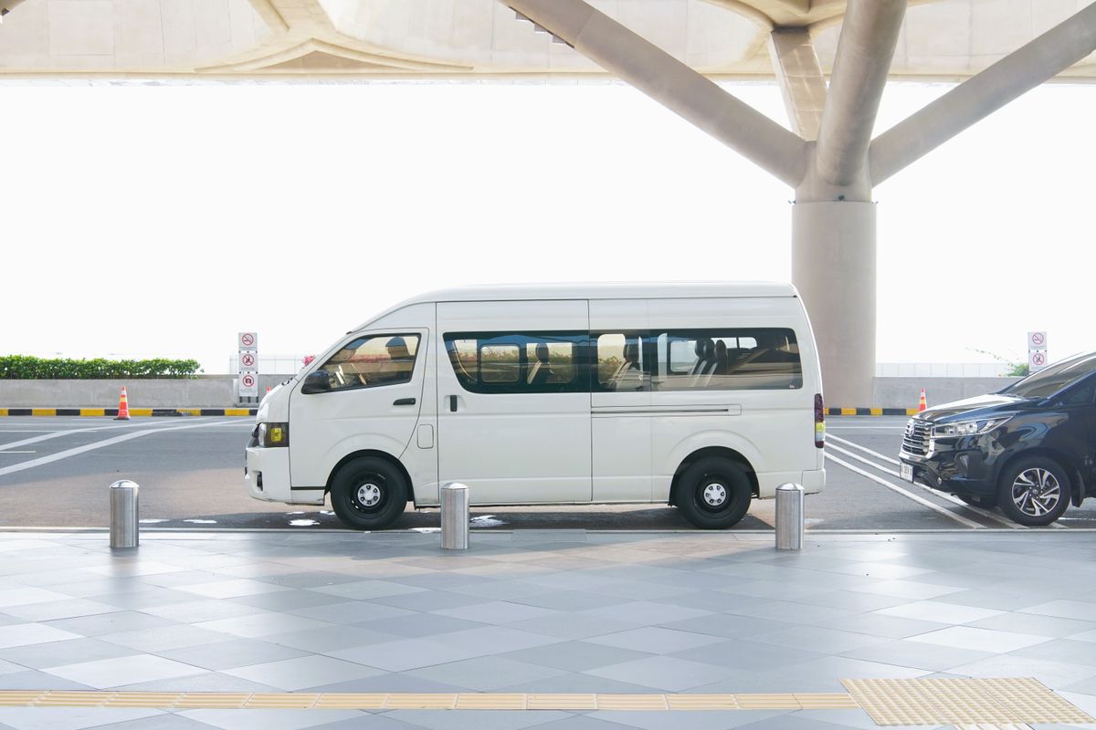 White Toyota Hiace minibus at the airport